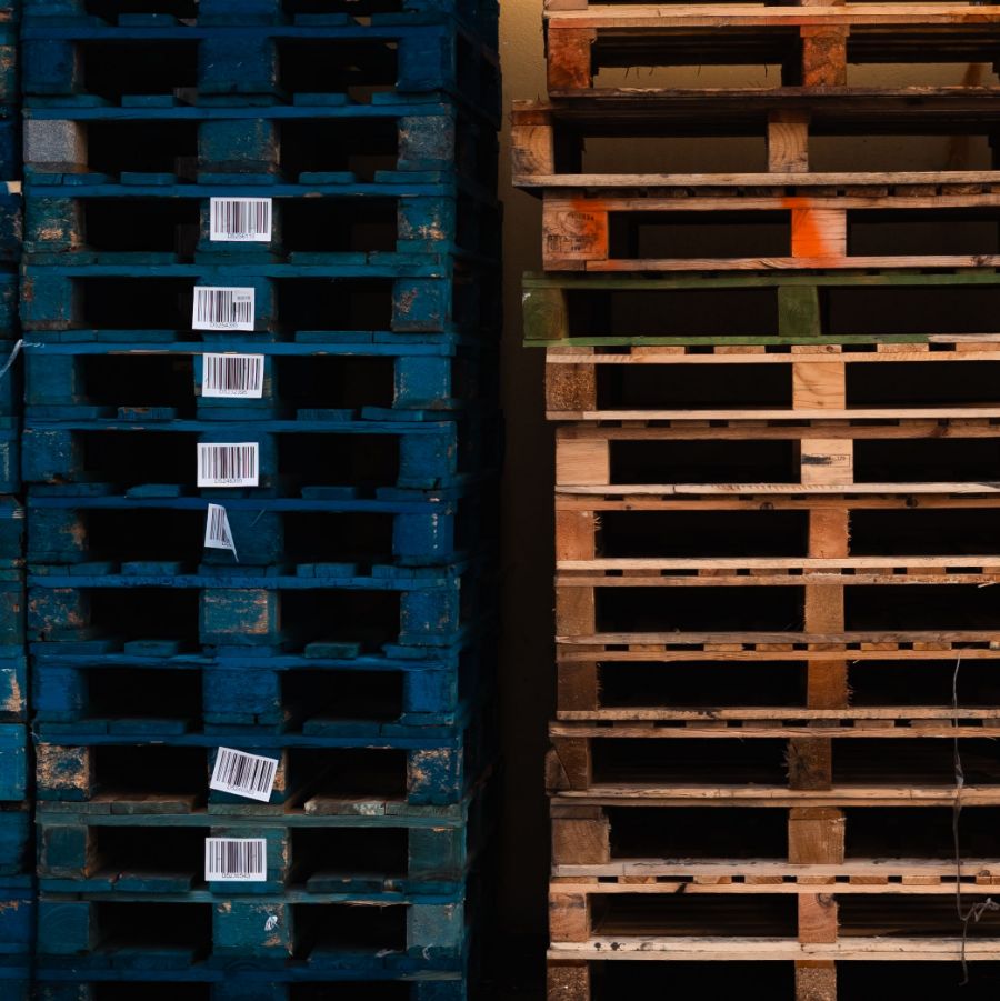 Stacked pallets with barcode labels in a distribution warehouse